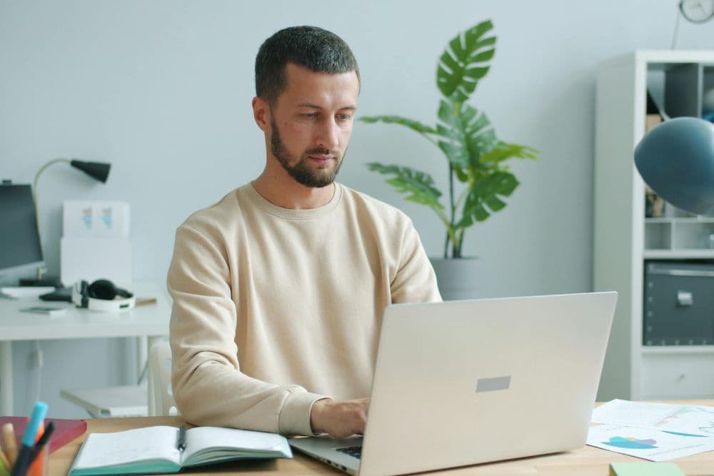 Man working on laptop at desk